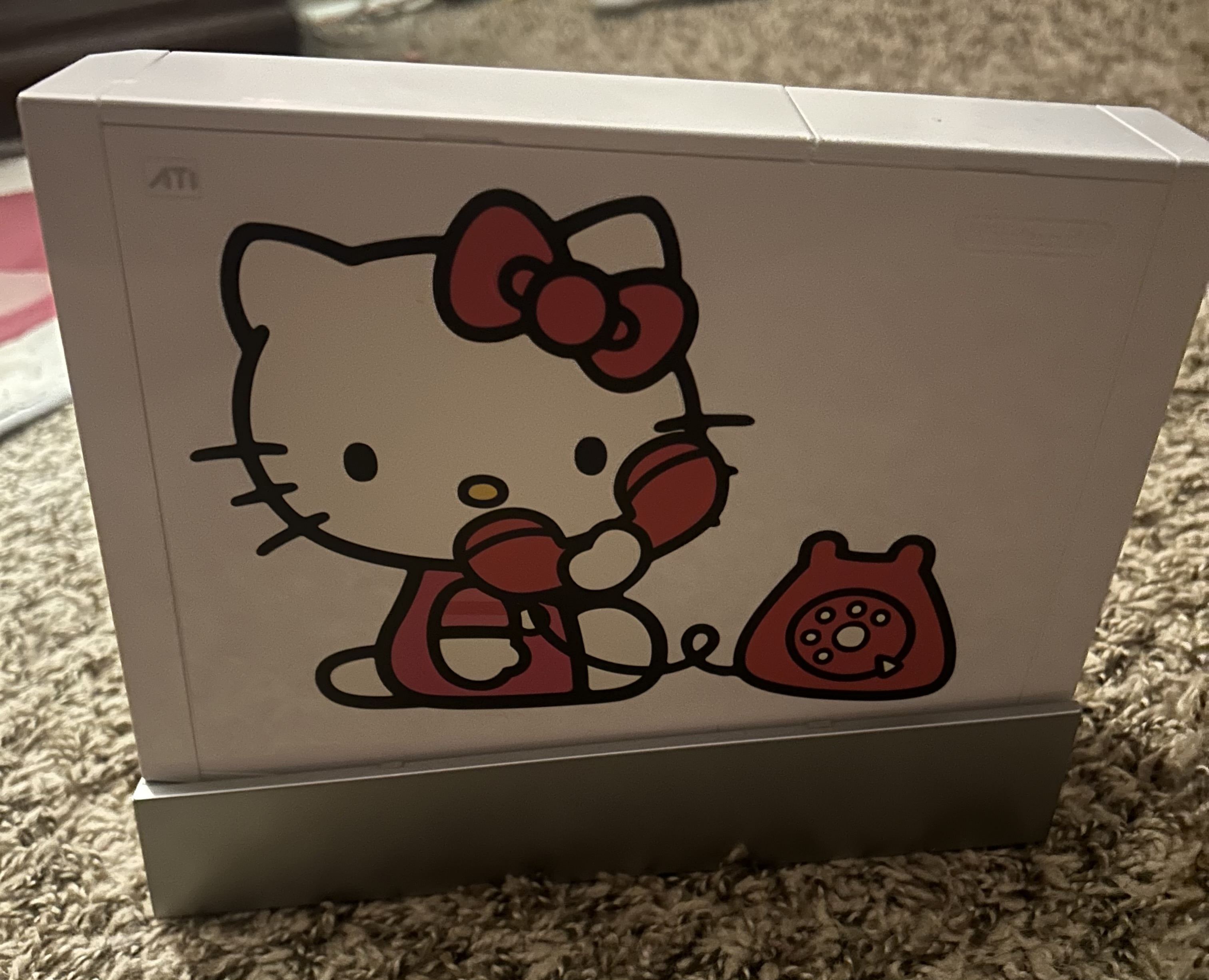 Wii Side View with Hello Kitty on a Telephone Sticker